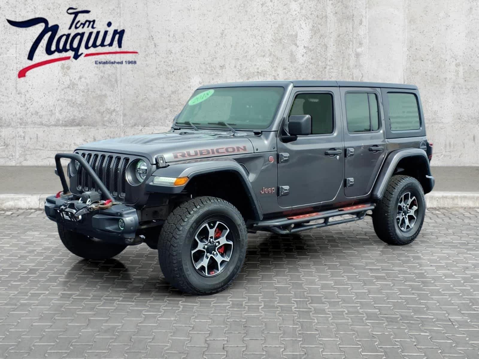 2018 Jeep Wrangler Unlimited Rubicon in Granite Crystal Metallic Clearcoat — front three-quarter view