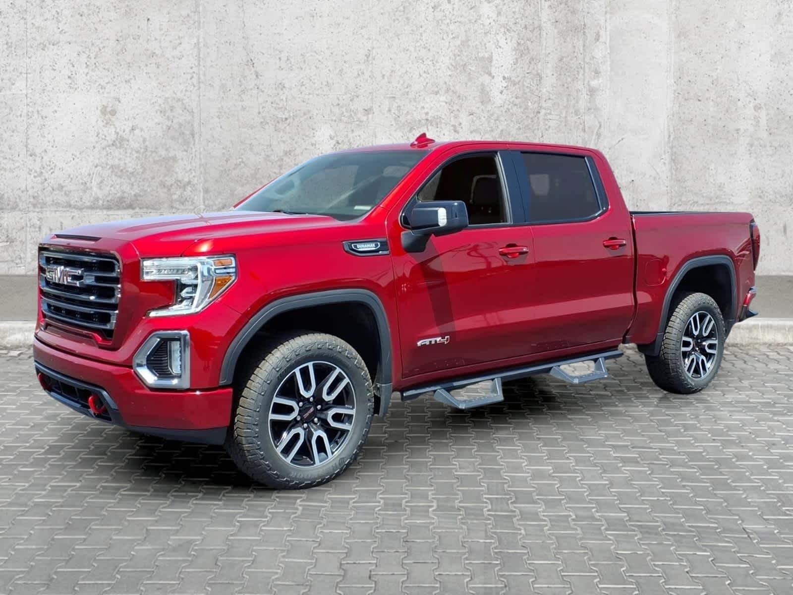 2021 GMC Sierra 1500 AT4 in Cayenne Red Tintcoat — front three-quarter view